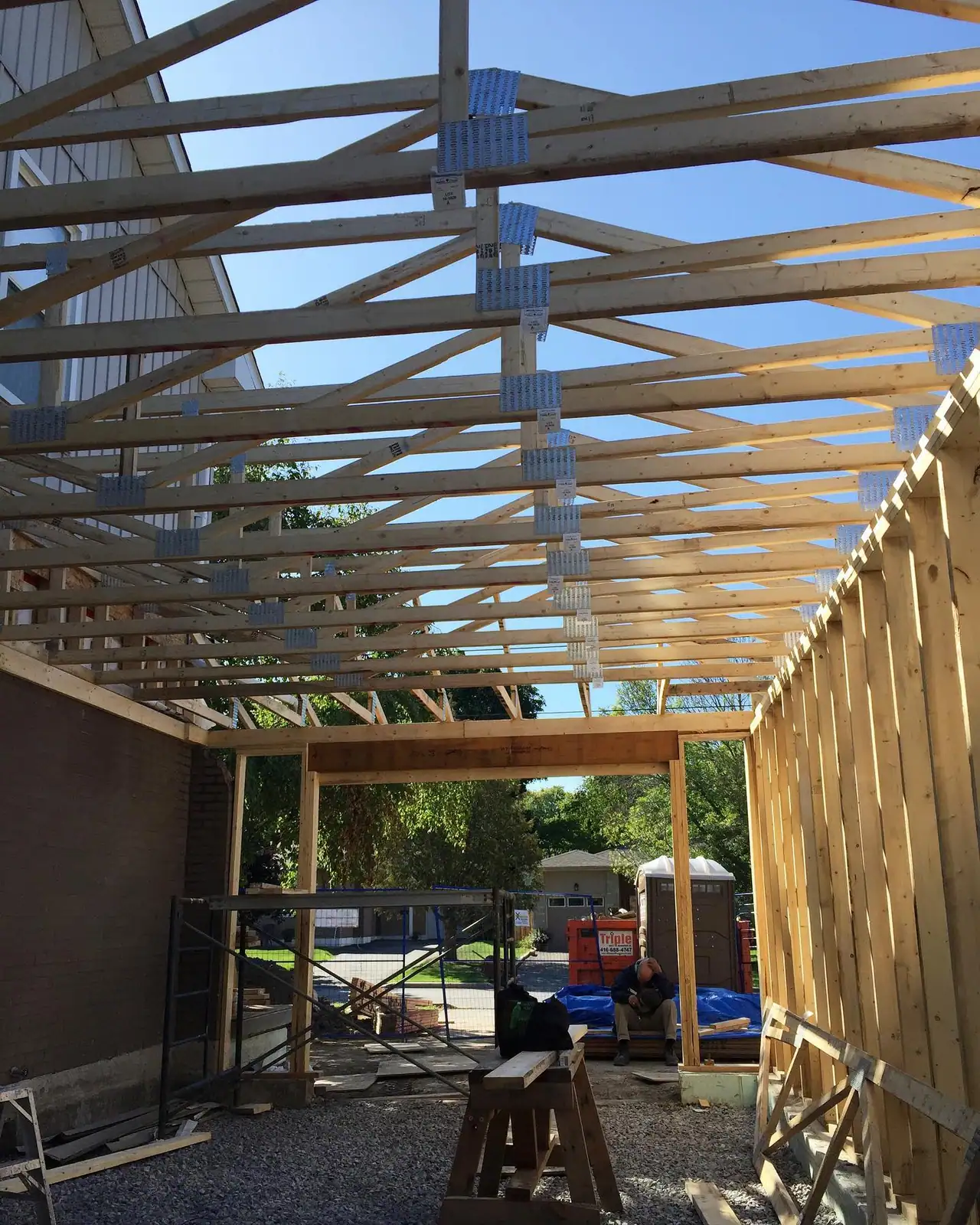 Before and after: a second-storey addition from first framing to closed-in, by CCS Group