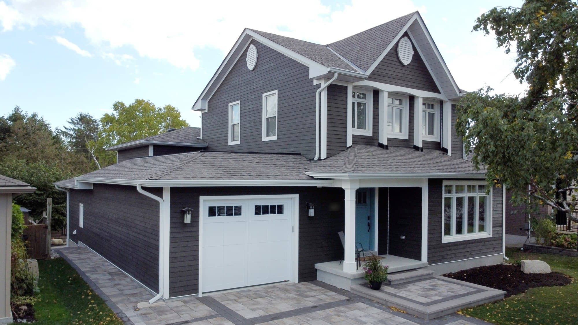 A finished second-storey addition with a new garage, built by CCS Group